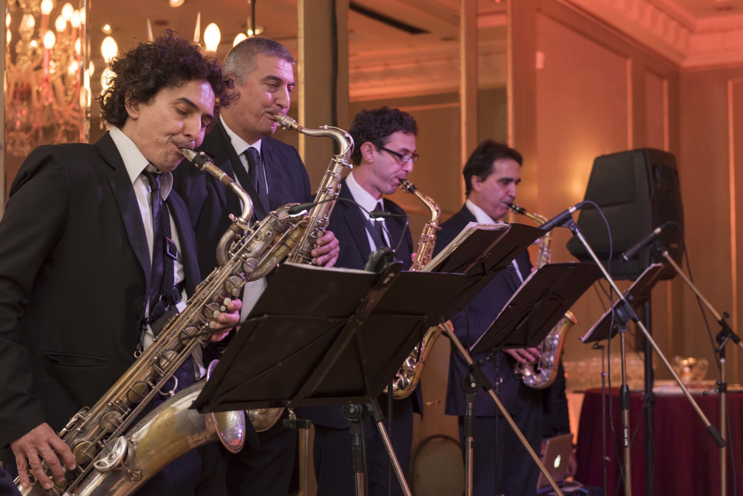 A four piece jazz band performs in a ballroom for a corporate event in Buenos Aires, Argentina