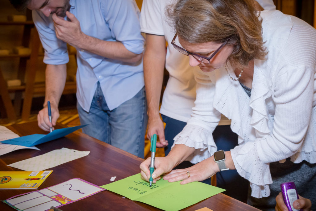 Two CSR event attendees write cards to local kids