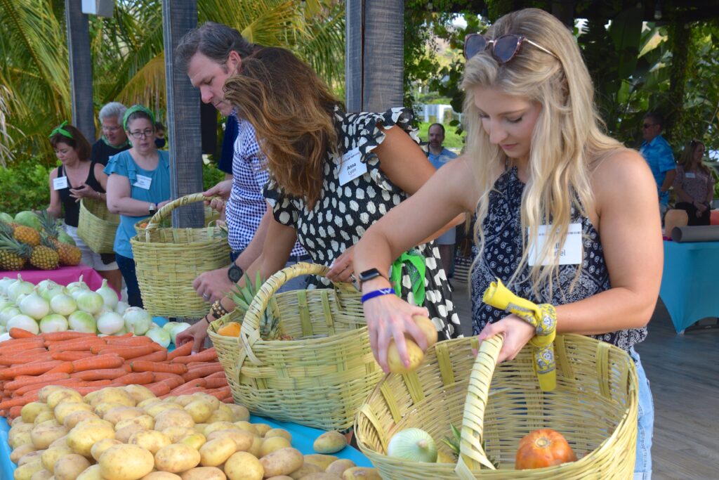 CSR activity - people pack baskets with fruit and vegetables