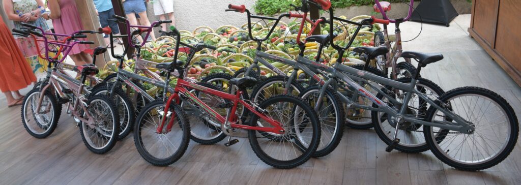 CSR activity results showing bikes and baskets of food