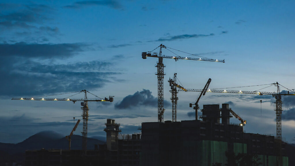 Public Affairs for Construction - several cranes above the buildings